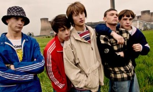 Spike Island cast members in wet-looking field