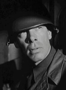 Lee Marvin as Lieutenant Colonel Clyde Bartlett, the creepy manipulative CO of the battalion.